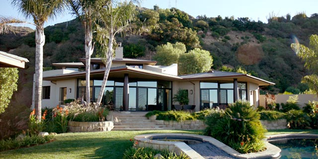 A Contemporary Tropical garden with a ocean view.